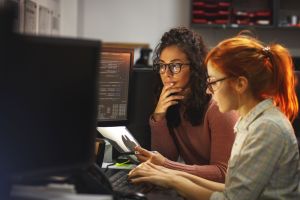 Two women reviewing accounts